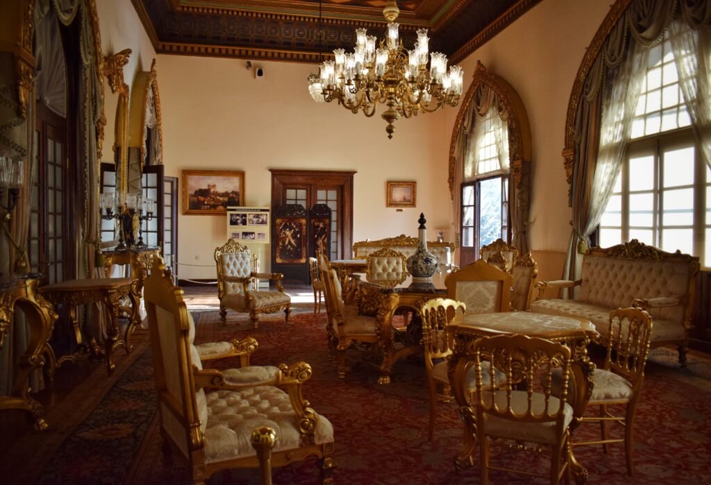 Opulent vintage interior with elegant furniture and a grand chandelier, perfect for luxury design concepts.